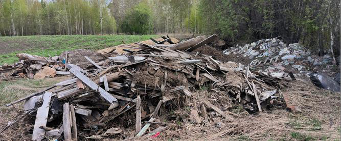 Доски и мешки с мусором: большую нелегальную свалку нашли в Томском районе